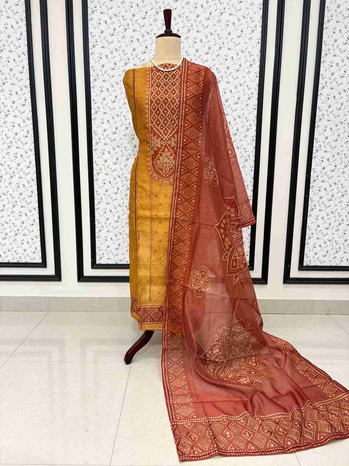 Yellow and red chanderi silk unstitched suit full flat lay set with shirt, dupatta, and cotton silk bottom
