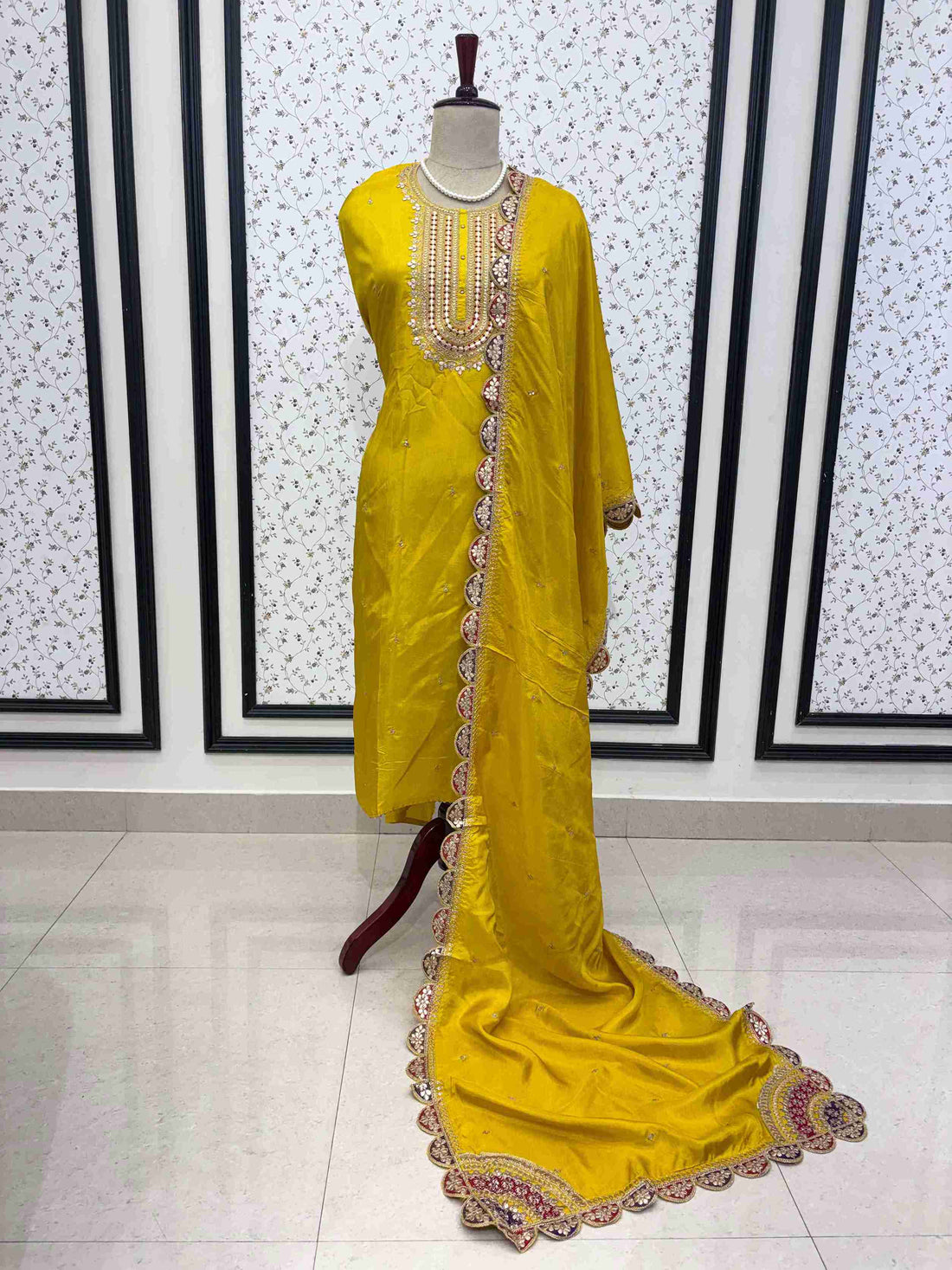 Yellow Russian silk embroidered unstitched suit set with scalloped dupatta on manequinn