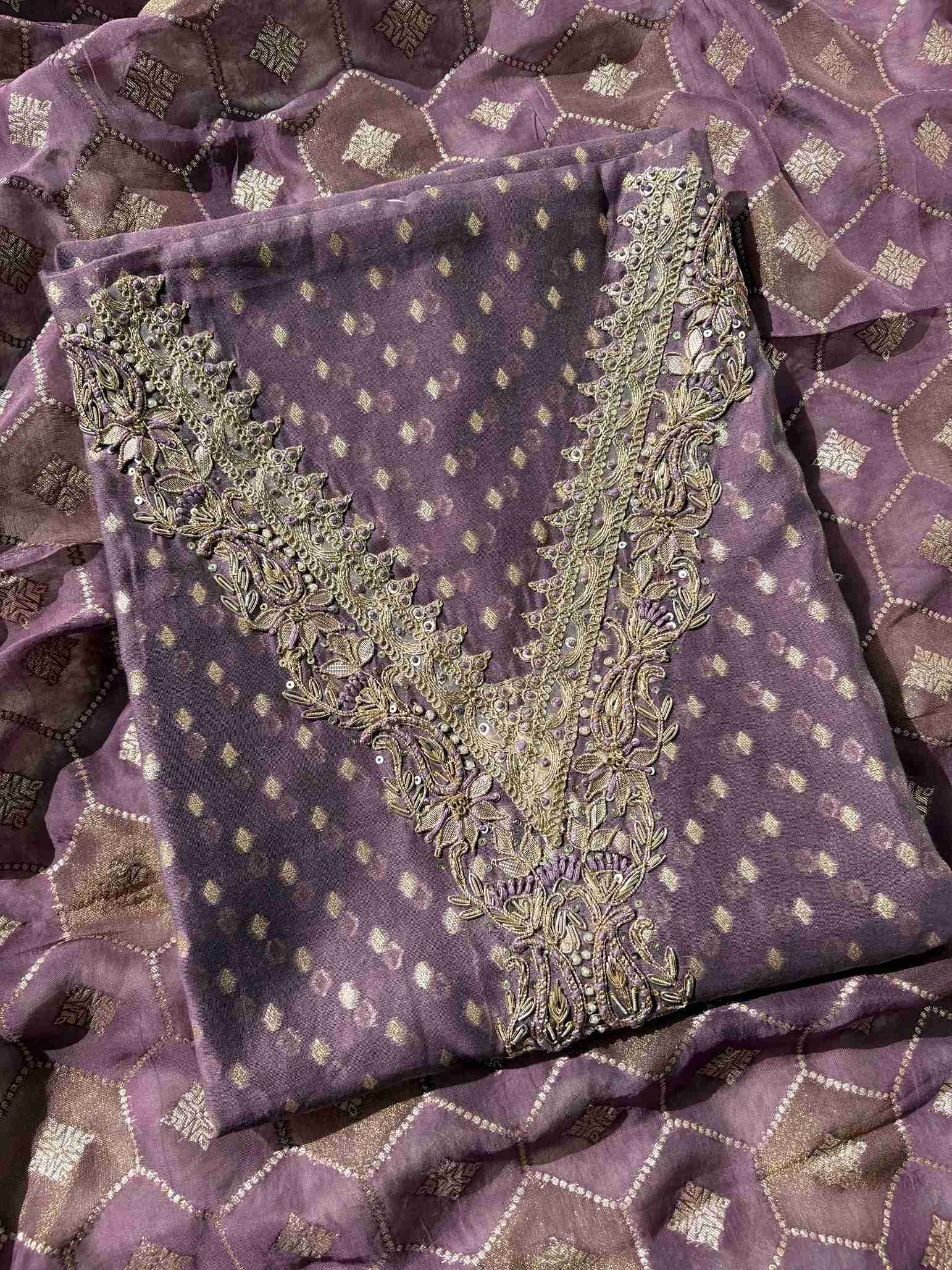 Close-up of Banarasi booti organza fabric with handworked neckline detailing