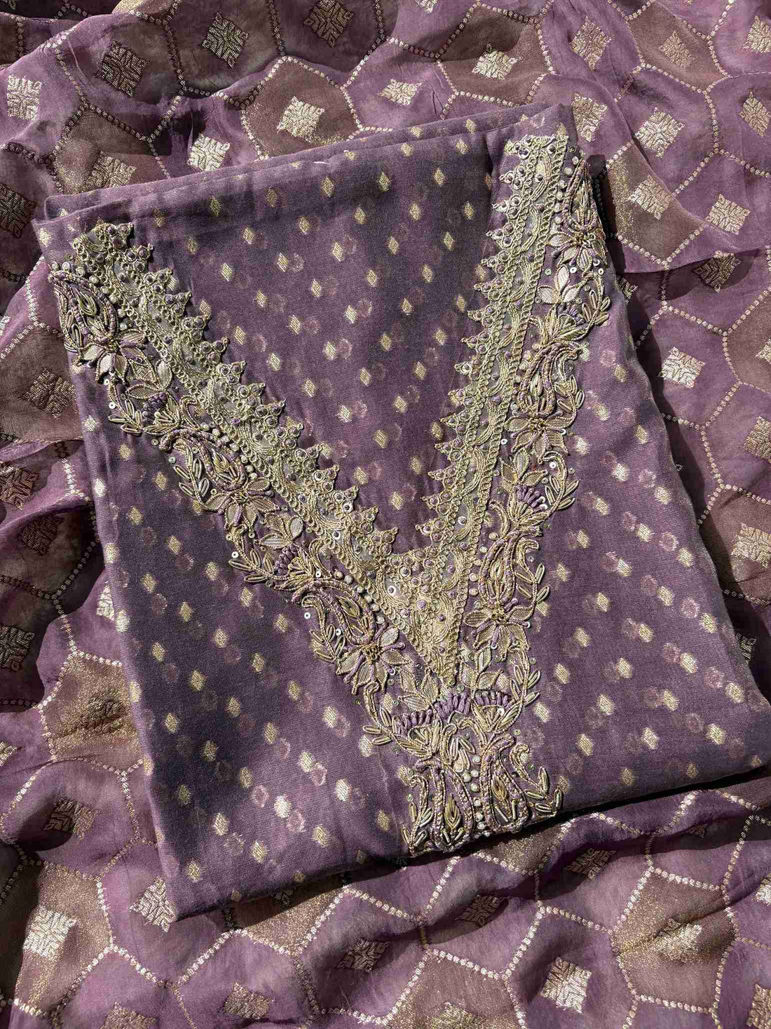 Close-up of Banarasi booti organza fabric with handworked neckline detailing